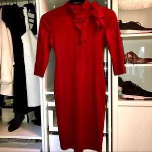 Red dress with 3/4 sleeves and bow in neck line.